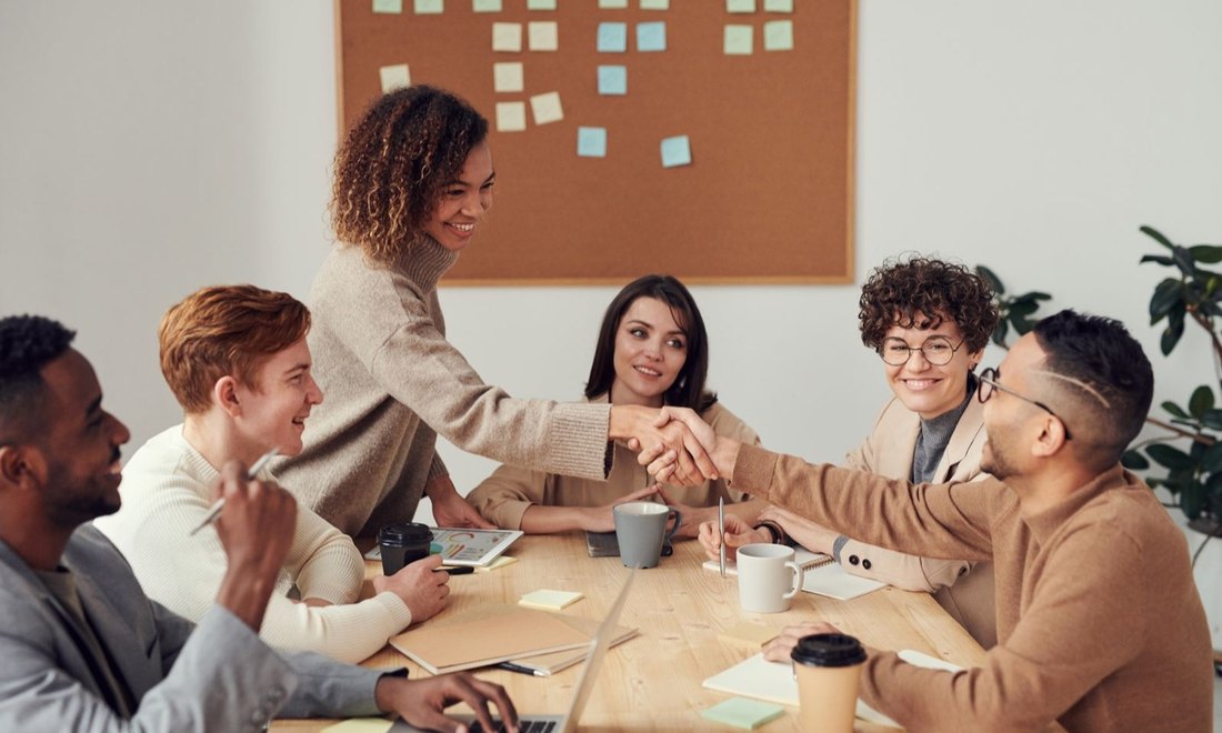 A diverse professional team meeting around a table
